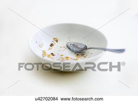 Empty cereal bowl and spoon against white background View Large Photo Image Picture - Empty cereal bowl and spoon against white background. Fotosearch