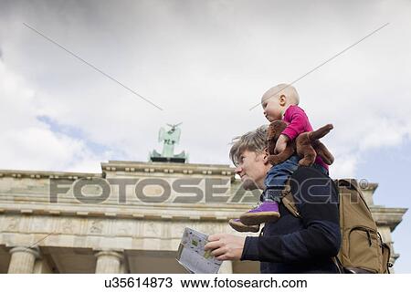 "Father sightseeing whilst giving baby daughter shoulder ride, Brandenburg Gate, Berlin, Germany" View Large Photo Image Stock Image - "Father sightseeing whilst giving baby daughter shoulder ride, Brandenburg Gate, Berlin, Germany". Fotosearch