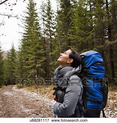 "Female hiker looking up in forest, Sarsy Village, Sverdlovsk Oblast, Russia" View Large Photo Image Stock Photo - "Female hiker looking up in forest, Sarsy Village, Sverdlovsk Oblast, Russia". Fotosearch