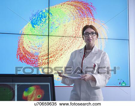 "Female scientist making presentation in front of graphical display of silicon wafer on screens, portrait" View Large Photo Image Stock Photography - "Female scientist making presentation in front of graphical display of silicon wafer on screens, portrait". Fotosearch