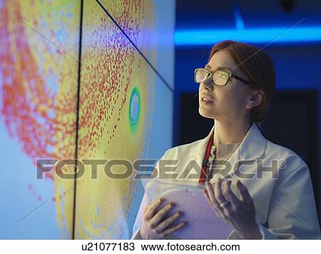 Female scientist with silicon wafer studying graphical display of wafer on screens View Large Photo Image Stock Image - Female scientist with silicon wafer studying graphical display of wafer on screens. Fotosearch