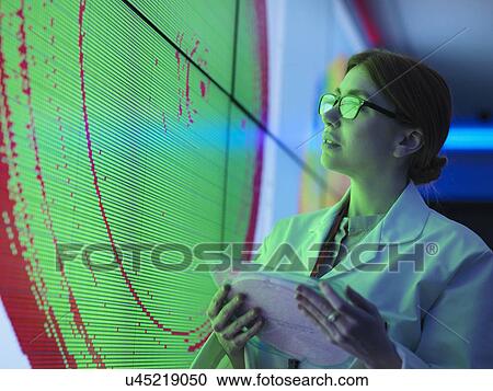 Female scientist with silicon wafer studying graphical display of wafer on screens View Large Photo Image Stock Image - Female scientist with silicon wafer studying graphical display of wafer on screens. Fotosearch