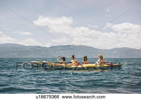 "Four young female friends kayaking on Lake Atitlan, Guatemala" View Large Photo Image Stock Photograph - "Four young female friends kayaking on Lake Atitlan, Guatemala". Fotosearch