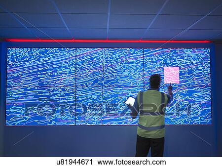 Geologist studying graphical display of oil and gas bearing rock on screens View Large Photo Image Stock Image - Geologist studying graphical display of oil and gas bearing rock on screens. Fotosearch