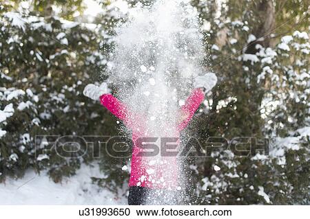 Girl playing outside in the snow View Large Photo Image Stock Image - Girl playing outside in the snow. Fotosearch