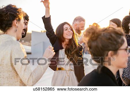 Group of friends dancing at party View Large Photo Image Stock Photography - Group of friends dancing at party. Fotosearch