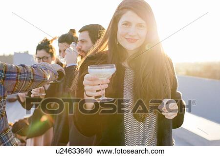 Group of friends drinking at party View Large Photo Image Stock Image - Group of friends drinking at party. Fotosearch