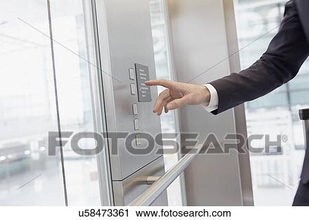 Hand of businessman pressing control in elevator View Large Photo Image Stock Image - Hand of businessman pressing control in elevator. Fotosearch