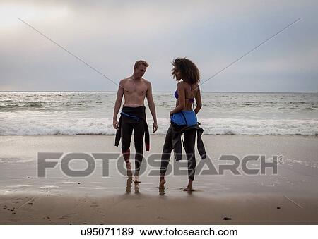 "Handsome young surfing couple on beach, Playa Del Rey, California, USA" View Large Photo Image Stock Photo - "Handsome young surfing couple on beach, Playa Del Rey, California, USA". Fotosearch
