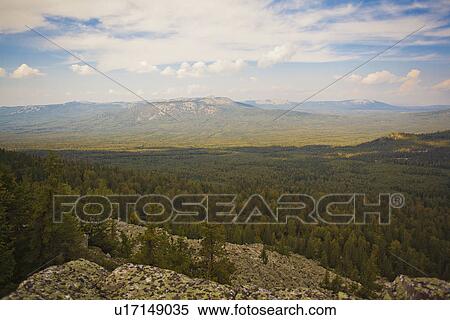 Stock Photography - "Landscape view of distant forest and mountains, Sarsy Village, Sverdlovsk Oblast, Russia". Fotosearch