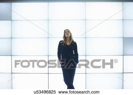 Mature woman leaning against backlit wall panels View Large Photo Image Stock Photography - Mature woman leaning against backlit wall panels. Fotosearch