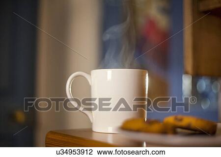 Mug of coffee and cookies on table View Large Photo Image Stock Image - Mug of coffee and cookies on table. Fotosearch