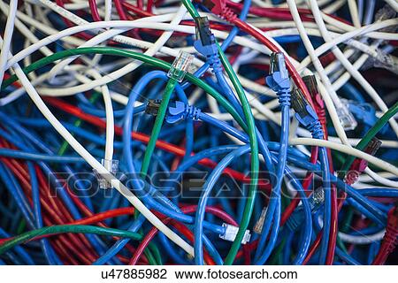 Stock Image - Multi-coloured network cables. Fotosearch