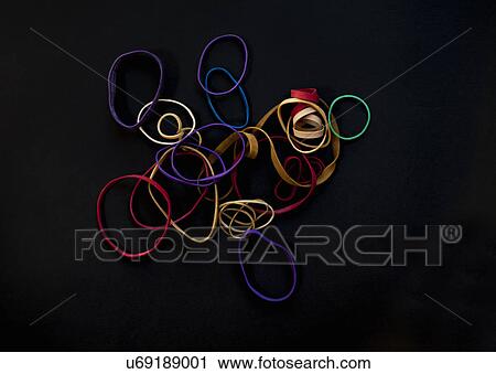 Stock Image - Multi-coloured rubber bands. Fotosearch