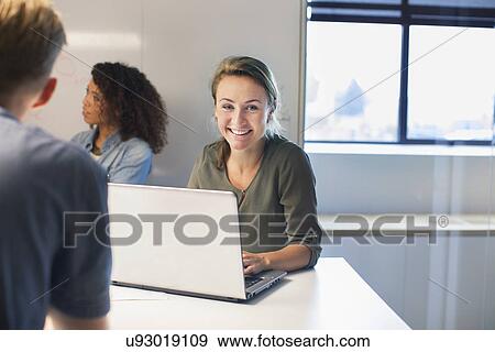 Over shoulder of woman at meeting View Large Photo Image Stock Photo - Over shoulder of woman at meeting. Fotosearch