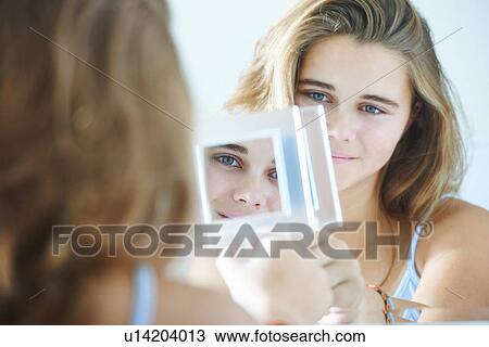Over the shoulder view of teenage girl mirror reflections View Large Photo Image Stock Image - Over the shoulder view of teenage girl mirror reflections. Fotosearch