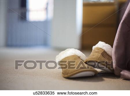 Pair of bedroom slippers on carpeted floor View Large Photo Image Stock Photography - Pair of bedroom slippers on carpeted floor. Fotosearch