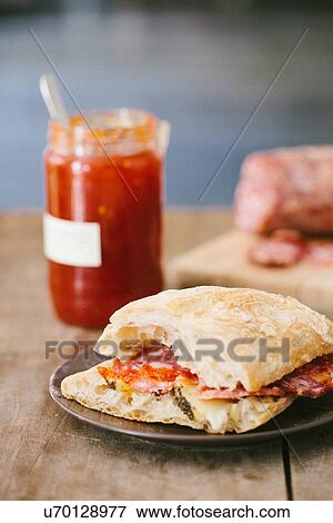 Panini with pecorino and finocchiona salami and jar of spicy mostarda View Large Photo Image Stock Photo - Panini with pecorino and finocchiona salami and jar of spicy mostarda. Fotosearch