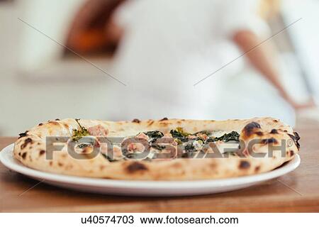 Plate of fresh pizza with sausage and chard View Large Photo Image Stock Image - Plate of fresh pizza with sausage and chard. Fotosearch