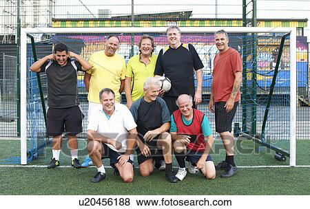 Portrait of group of men in football goal View Large Photo Image Stock Photo - Portrait of group of men in football goal. Fotosearch