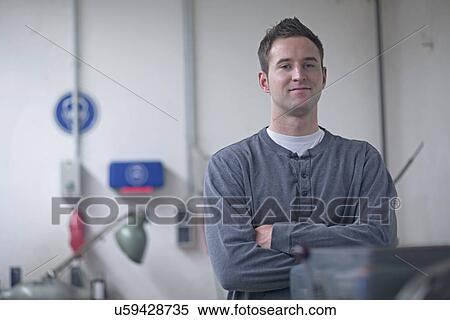 Stock Photography - Portrait of male technician in workshop. Fotosearch