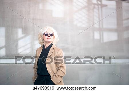 "Portrait of mature businesswoman, wearing sunglasses" View Large Photo Image Stock Photo - "Portrait of mature businesswoman, wearing sunglasses". Fotosearch
