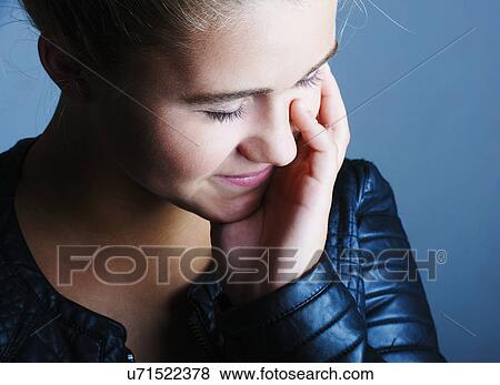 Portrait of shy pretty teenage girl View Large Photo Image Stock Photo - Portrait of shy pretty teenage girl. Fotosearch