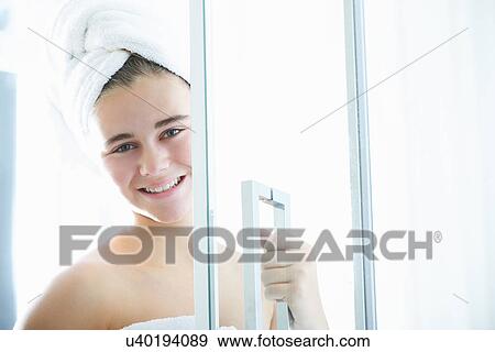 Portrait of teenage girl leaving shower View Large Photo Image Stock Photo - Portrait of teenage girl leaving shower. Fotosearch