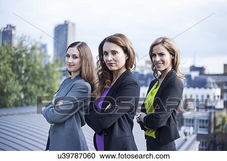 "Portrait of three businesswomen, outdoors" View Large Photo Image Stock Image - "Portrait of three businesswomen, outdoors". Fotosearch