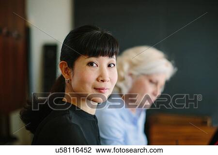 Portrait of two mature businesswomen in office View Large Photo Image Stock Image - Portrait of two mature businesswomen in office. Fotosearch