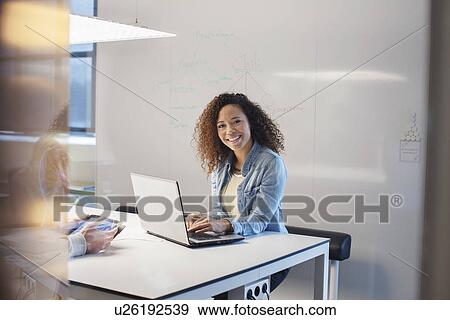Portrait of woman at meeting View Large Photo Image Stock Photo - Portrait of woman at meeting. Fotosearch