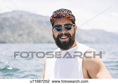 "Portrait of young man in front of Lake Atitlan, Guatemala" View Large Photo Image Stock Image - "Portrait of young man in front of Lake Atitlan, Guatemala". Fotosearch