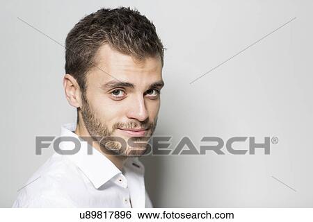 Portrait of young man smiling View Large Photo Image Stock Photograph - Portrait of young man smiling. Fotosearch
