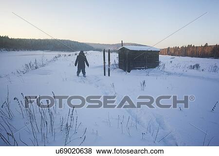 "Rear view of man in snow covered landscape, Sarsy village, Sverdlovsk Oblast, Russia" View Large Photo Image Stock Photo - "Rear view of man in snow covered landscape, Sarsy village, Sverdlovsk Oblast, Russia". Fotosearch
