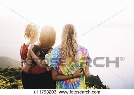"Rear view of three female friends looking out over Lake Atitlan, Guatemala" View Large Photo Image Stock Image - "Rear view of three female friends looking out over Lake Atitlan, Guatemala". Fotosearch