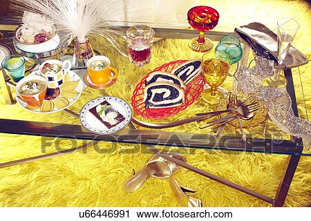 Stock Image - Retro style coffee table with fibre optic lamp and drinking glasses. Fotosearch