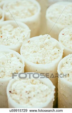 Stock Photo - "Rows of artisan ricotta cheese, Tuscany, Italy". Fotosearch