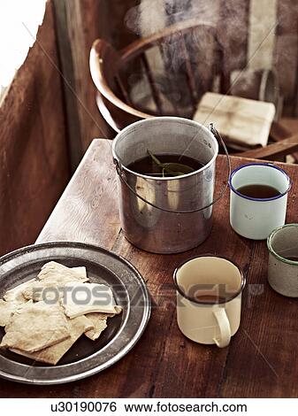 Rustic table with billycan tea and biscuits View Large Photo Image Stock Photograph - Rustic table with billycan tea and biscuits. Fotosearch