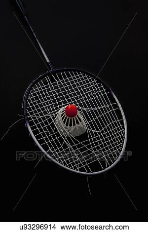 Shuttlecock jammed into broken badminton racket View Large Photo Image Picture - Shuttlecock jammed into broken badminton racket. Fotosearch