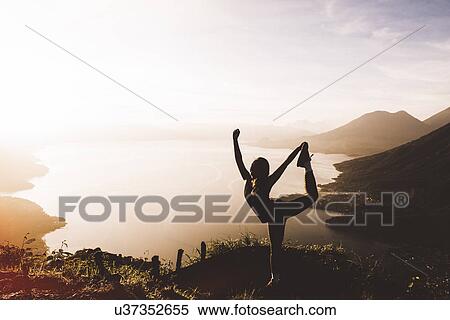 "Silhouetted view of young woman posing at sunset above Lake Atitlan, Guatemala" View Large Photo Image Stock Photography - "Silhouetted view of young woman posing at sunset above Lake Atitlan, Guatemala". Fotosearch
