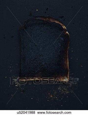 Slice of burnt toast View Large Photo Image Stock Photo - Slice of burnt toast. Fotosearch