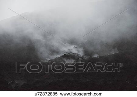 Stock Photography - "Smokey volcanic landscape at Pacaya volcano, Antigua, Guatemala". Fotosearch