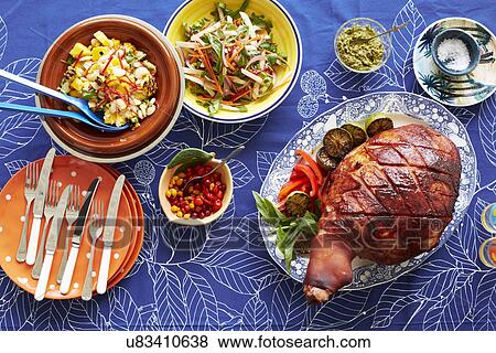 Still life of baked creole ham and side dishes View Large Photo Image Stock Photo - Still life of baked creole ham and side dishes. Fotosearch