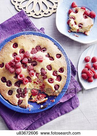 Stock Photograph - Still life of Czech bublanina cake with raspberries. Fotosearch