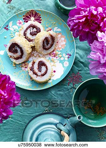 Stock Photo - Still life of Donkey Rolling dessert with glutenous rice and red bean sauce. Fotosearch
