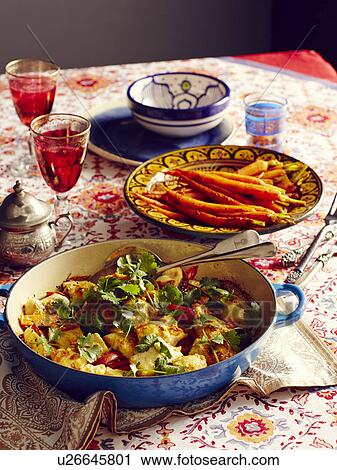 Stock Image - Still life of Moroccan harissa dish with carrots. Fotosearch