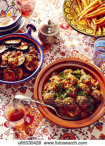 Still life of Moroccan kefta meatballs with eggplant and carrots View Large Photo Image Stock Photo - Still life of Moroccan kefta meatballs with eggplant and carrots. Fotosearch