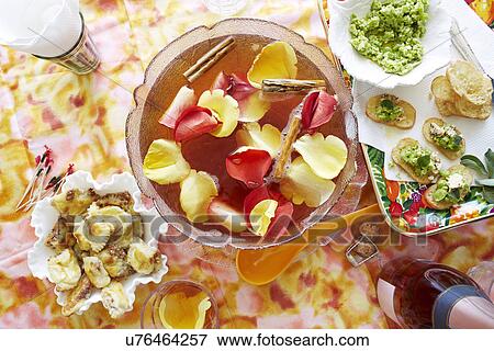 Stock Photo - Still life of punch cocktail bowl with party snacks. Fotosearch