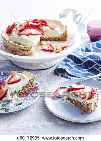 Stock Photography - Still life of strawberry meringue cake. Fotosearch