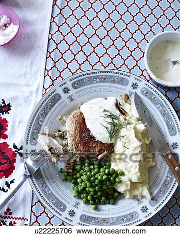 "Still life of Ukrainian meal with plate of pork cutlets, mashed potato and peas" View Large Photo Image Stock Photograph - "Still life of Ukrainian meal with plate of pork cutlets, mashed potato and peas". Fotosearch